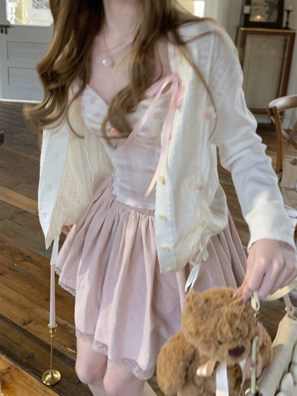 Teenage girl hugging flower cut-out floral knit cardigan